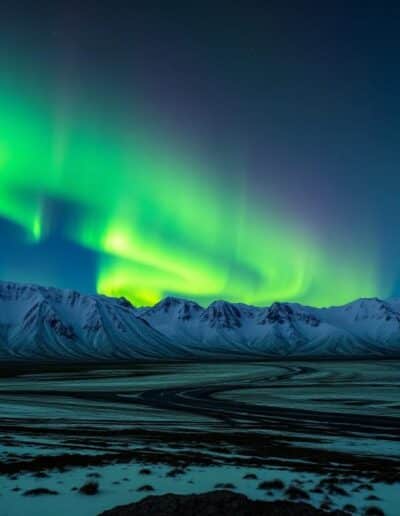 Northern lights aurora borealis over snowy landscape — Elias Thorne Photography